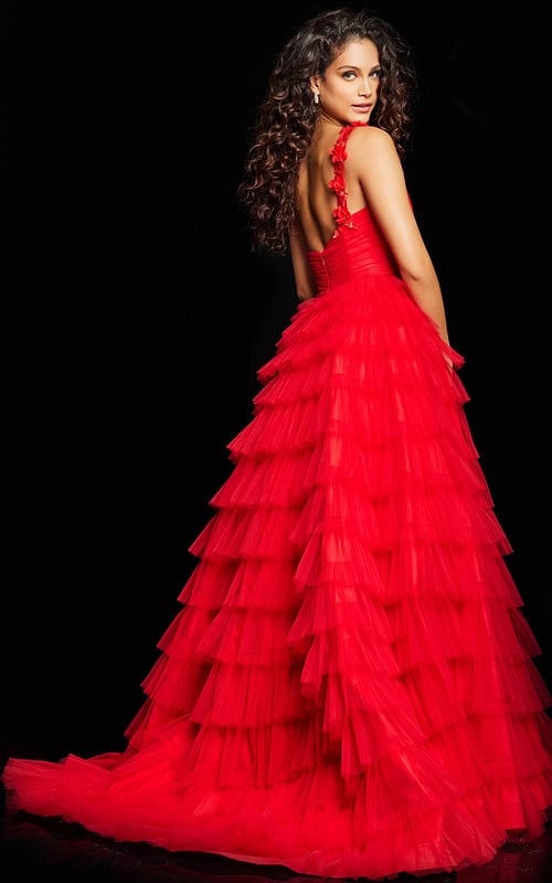 Model wearing Jovani 37274 red gown, back view showing layered tulle skirt.