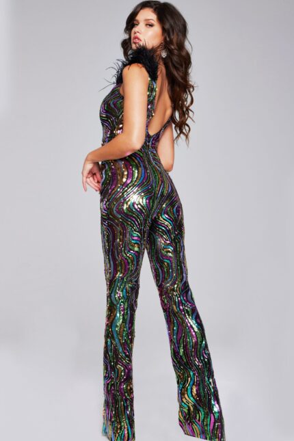 Model showing back view of Jovani 37276 multi-colored sequined jumpsuit with feathered shoulders.