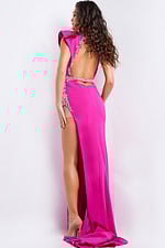 Model wearing Jovani 37342 fuchsia gown with open back and embellishments, back view.