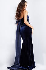 Back view of model wearing Jovani 37391 navy dress with elegant back design.