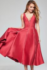 Model wearing Jovani 37393 red dress featuring a V-neckline and A-line flare.