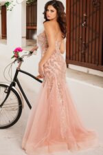 Model wearing Jovani 37412 blush gown showing back with intricate detailing