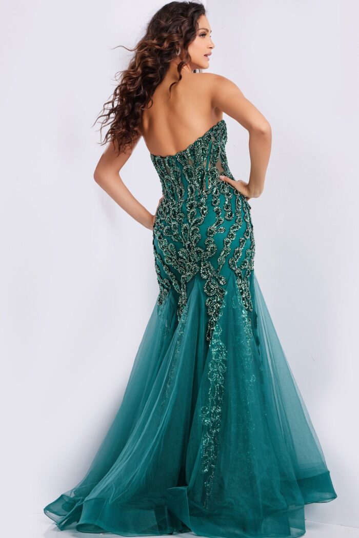 Model wearing Jovani 37412 green gown back view showing intricate design