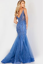 Model in Jovani 37416 blue gown with V-back, showcasing back details.