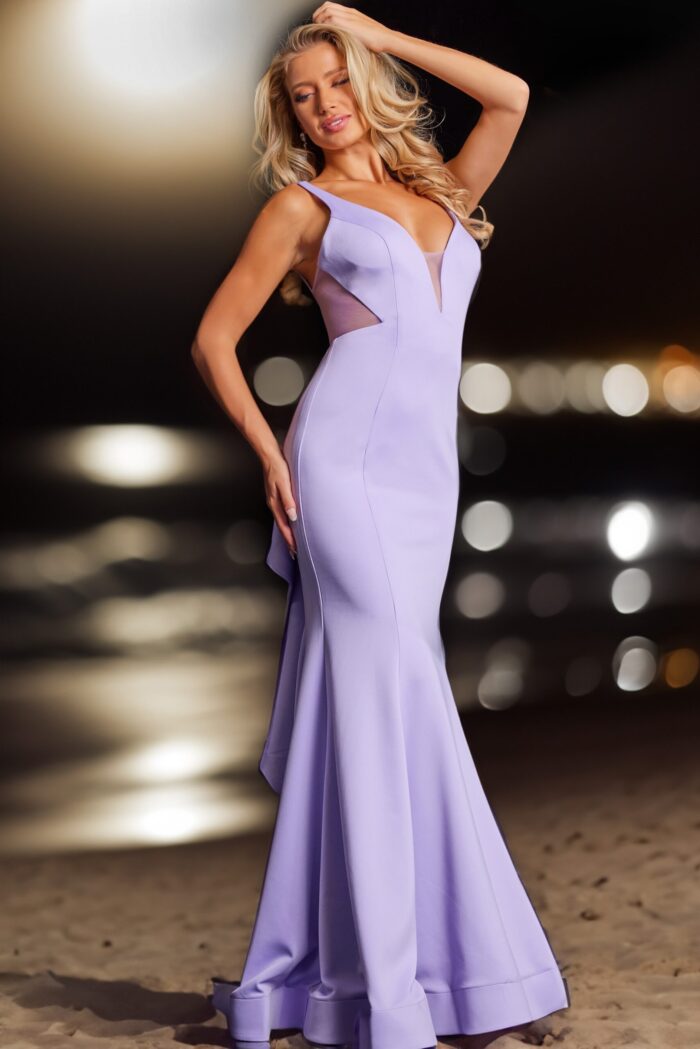 Model wearing Jovani 37430 lilac dress with side cutouts and V-neckline.