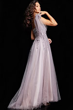 model wearing 37467 blush gown showing back view with flowing skirt and tulle straps