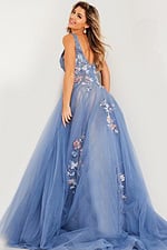Model showing back view of Jovani 37468 blue gown with floral appliqués.