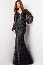model showcasing Jovani 37558 black gown with sheer embellished sleeves