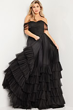 model in Jovani 37608 off-the-shoulder black gown with tulle layers