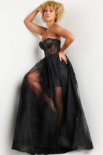 Model in Jovani 37646 black dress with sweetheart neckline and embroidered detail.