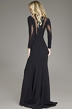 Back angle of model in Jovani 37671 black dress showcasing long sleeves and mesh detailing.
