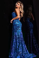 Model wearing Jovani 37687 blue mermaid dress, back view highlighting the silhouette.