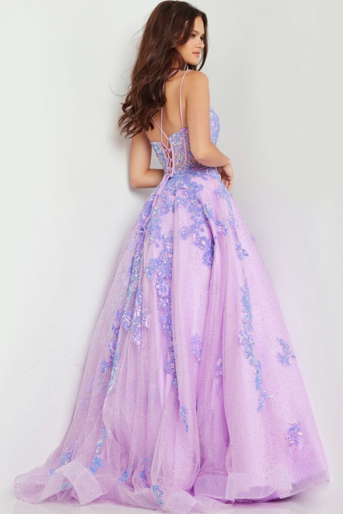 Model wearing Jovani 37700 lilac ball gown, showcasing back design and train.