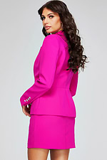 Side back view of model wearing Jovani 38082 fuchsia dress with embellished sleeves.