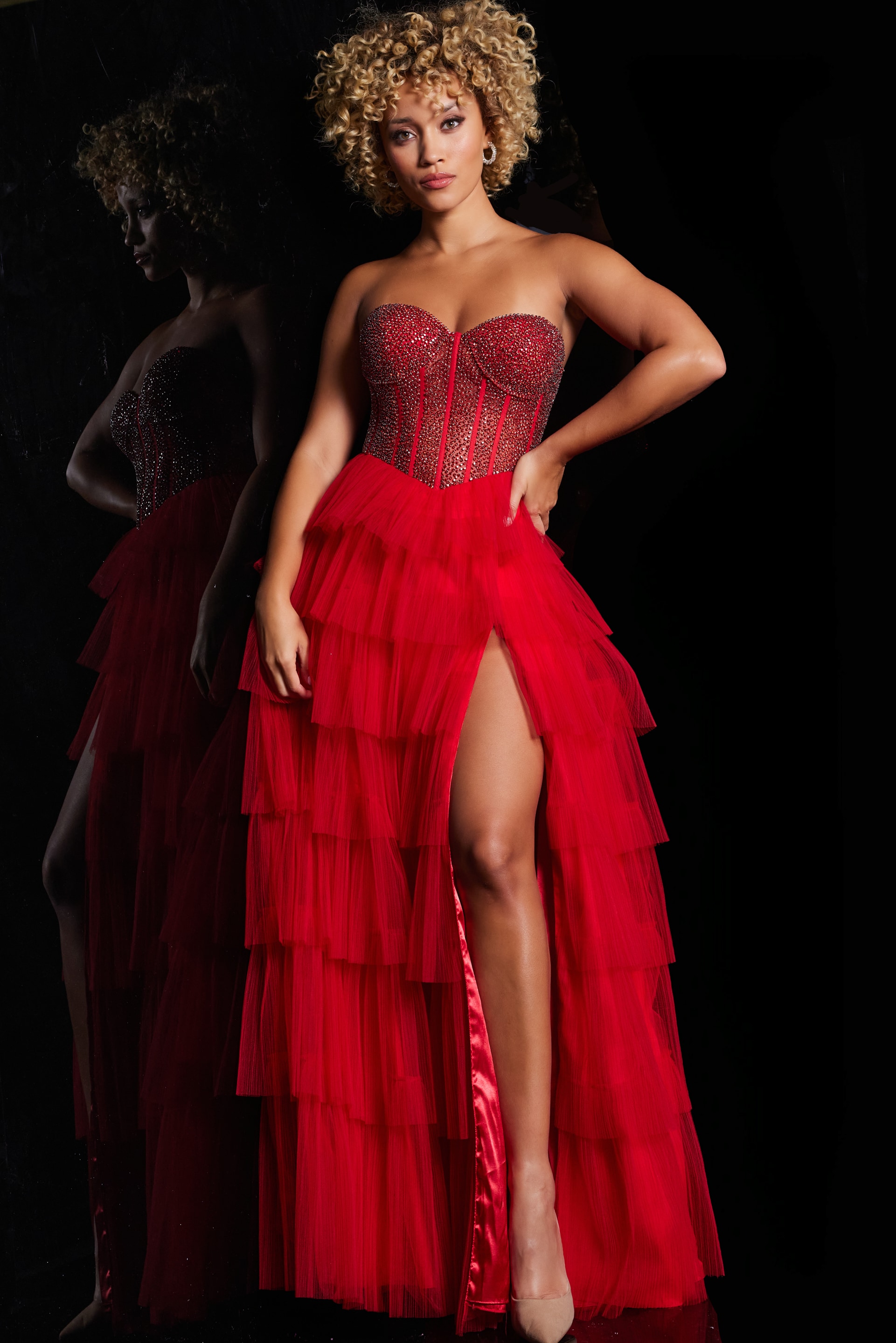 38090_red.jpg model wearing Jovani 38090 red dress with sweetheart neckline and tiered skirt