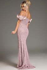 Model wearing Jovani 38112 blush mermaid gown with ruffled off-shoulder design, back view.