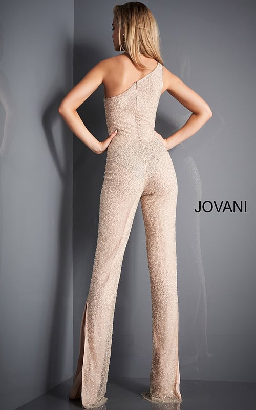 Back view of model wearing Jovani 3816 nude jumpsuit showing one-shoulder detail