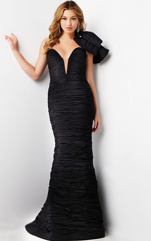 Model wearing Jovani 38240 black dress with deep V neckline and bow.
