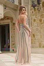 Model wearing Jovani 38263 dress with intricate back detailing, back view.