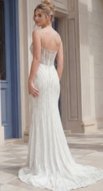 Back view of a fitted beaded gown with delicate straps and low back