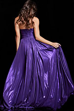 Back view of model wearing Jovani 38280 purple gown with elegant flow.