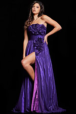 Model wearing Jovani 38280 purple gown with floral details and high slit, front view.
