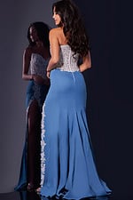 Model wearing Jovani 43341 dress showcasing the back design, featuring lace appliqué details in lilac.