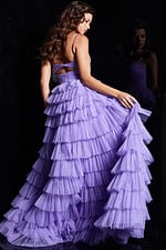 Model wearing Jovani 38290 lilac dress showing ruffled back, back view