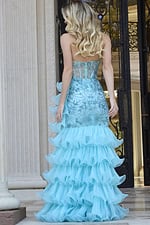 Back view of Jovani 38295 blue gown highlighting ruffle layers and beadwork.