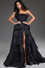 Model in Jovani 38301 black gown highlighting strapless neckline and high slit.