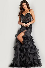 Model wearing Jovani 38358 black gown with intricate sequin detailing.