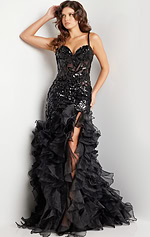 Model showcasing Jovani 38358 black dress with sweetheart neckline and ruffled skirt.
