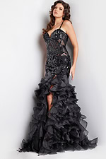 Full view of model in Jovani 38358 black gown with sequin bodice and high slit.