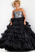 Model wearing Jovani 38360 strapless gown with zebra pattern and layered tulle skirt, back view.