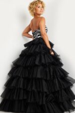 Model wearing Jovani 38360 strapless gown with zebra pattern and layered tulle skirt, alternate front view.
