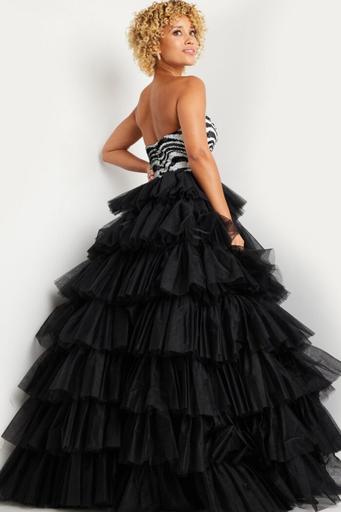 Model wearing Jovani 38360 strapless gown with zebra pattern and layered tulle skirt, alternate front view.