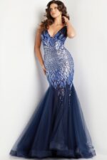 Model wearing Jovani 38373 navy mermaid gown with sequin bodice and tulle skirt, front view.