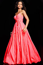 Model posing in Jovani 38382 pastel pink dress with flowing skirt