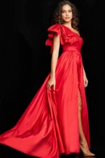 Model in Jovani 38466 red gown, showing off the A-line silhouette with high slit.