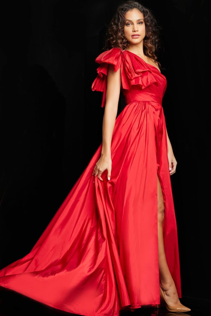 Model in Jovani 38466 red gown, showing off the A-line silhouette with high slit.