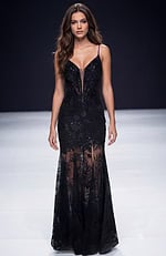 Fitted gown with sheer lace skirt, plunging illusion neckline, and delicate beaded detailing creating a sleek, elegant silhouette