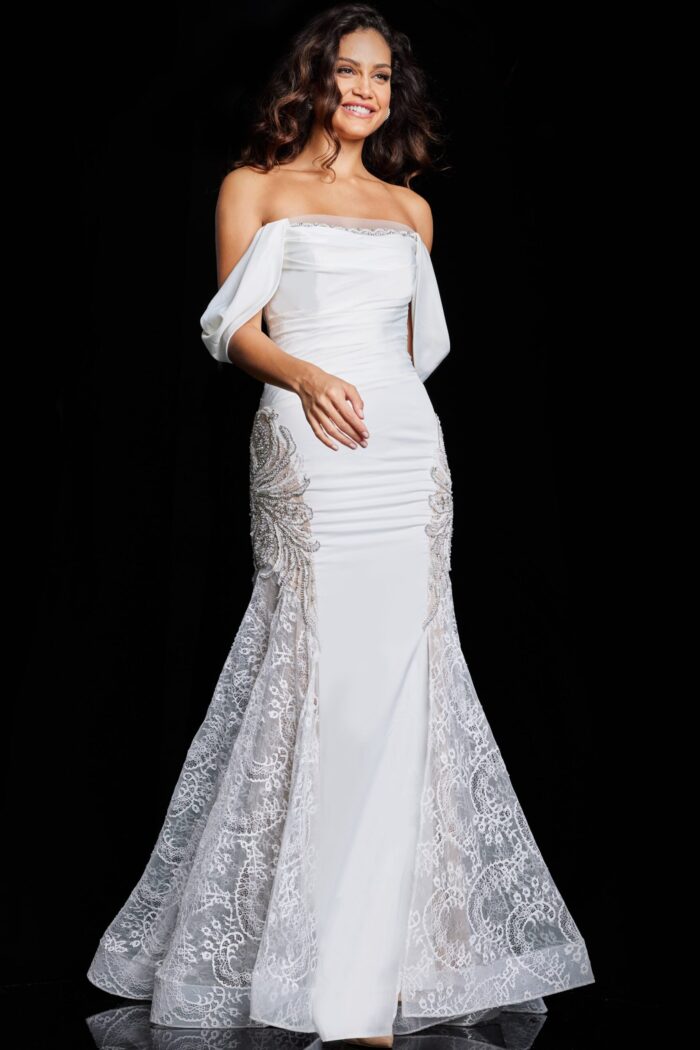 Model wearing Jovani 38501 ivory dress in a front view showcasing lace detailing.