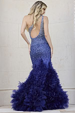 Model in Jovani 38507 blue gown showing open back design and ruffle skirt, facing back