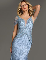 Model in Jovani 38514 blue gown with V-neckline and intricate lace details.