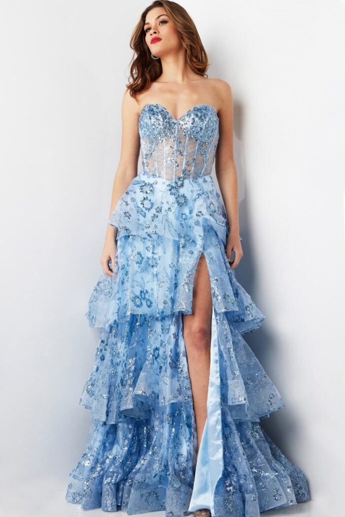 Model in Jovani 38528 light blue dress showcasing front design with high slit