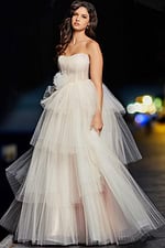 Model displaying the Jovani 38537 blush ball gown with layered tulle details.