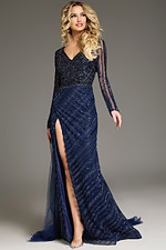 Model wearing Jovani 38581 navy gown, full-length view, featuring sheer sleeves and high slit.