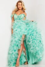 Model wearing Jovani 38606 green dress with off-the-shoulder neckline and cascade tulle layers.