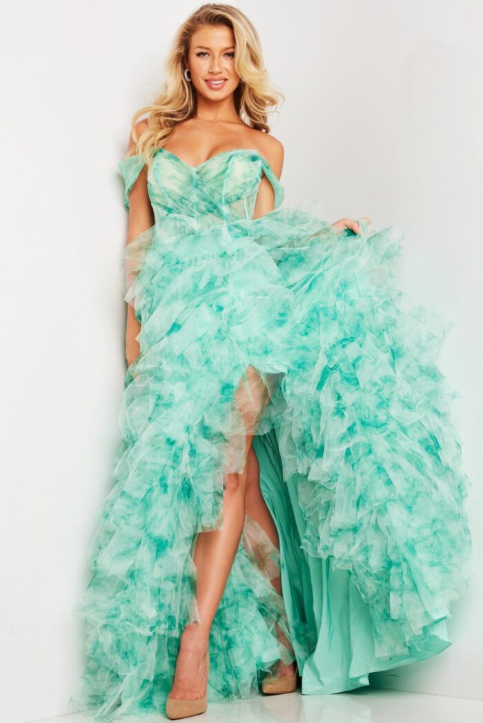 Model wearing Jovani 38606 green dress with off-the-shoulder neckline and cascade tulle layers.