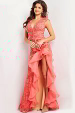 Jovani 38668 coral gown with front ruffle and high slit on model.